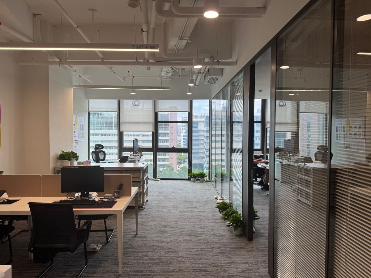 Modern office interior with plants and glass walls